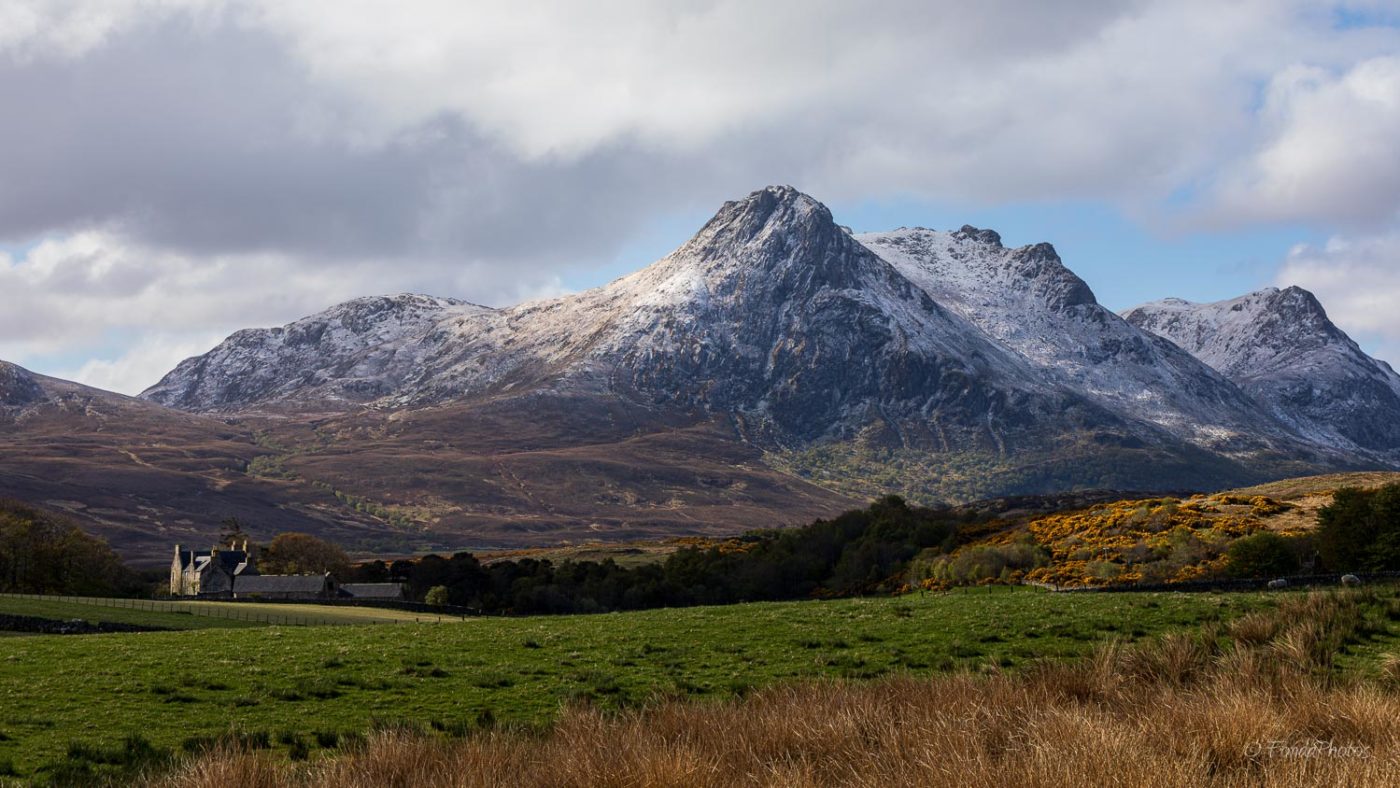 Ben Loyal covered by light snow, farm in Ribigill